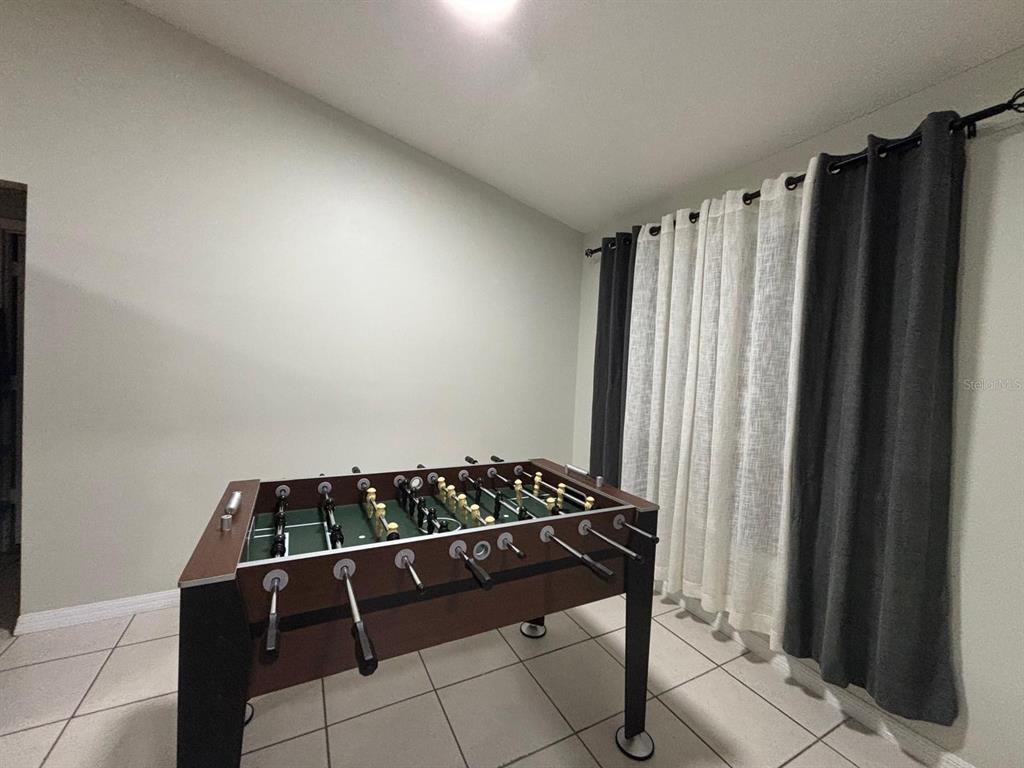 1464 Howland Boulevard Deltona, FL 32738 - Photo 28 of 55 a black and white photo of a living room