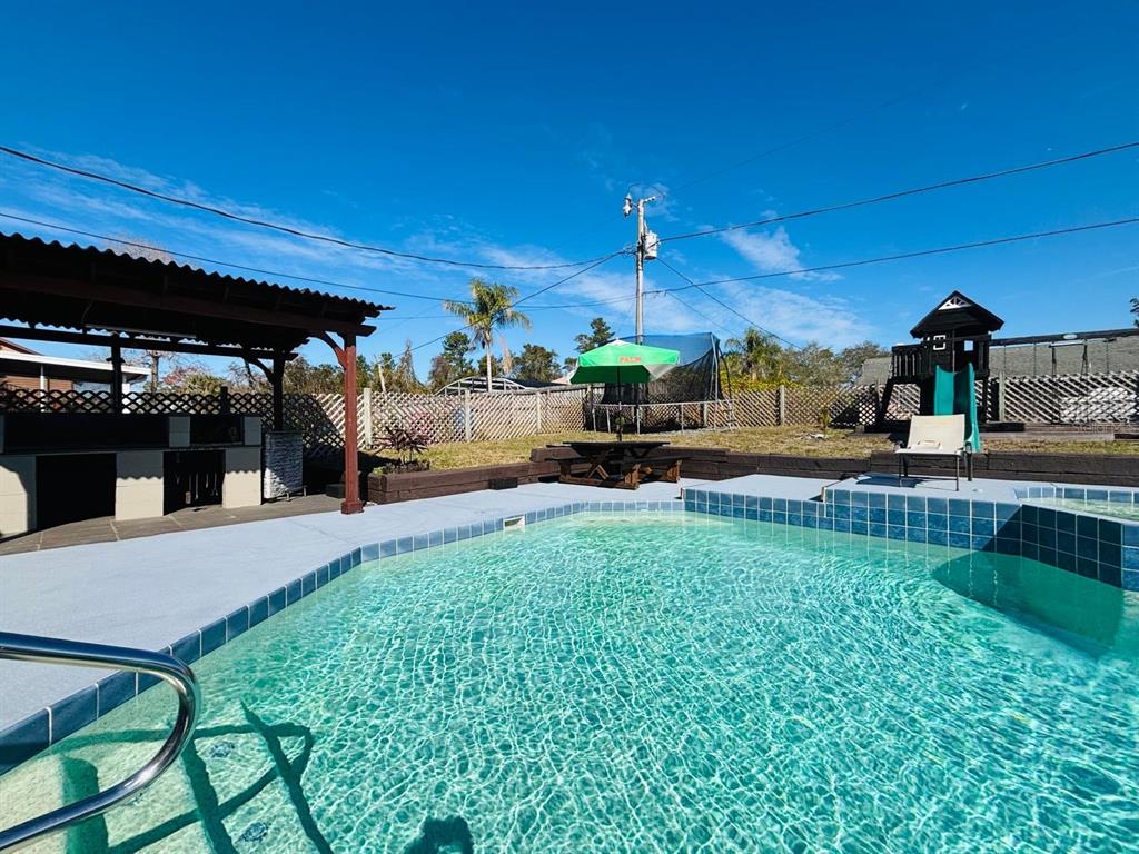 1464 Howland Boulevard Deltona, FL 32738 - Photo 31 of 55 a view of a backyard with sitting area