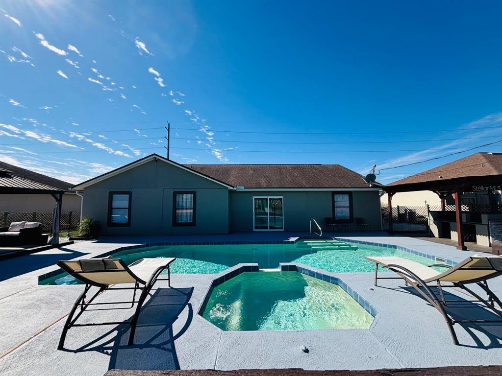 1464 Howland Boulevard Deltona, FL 32738 - Photo 33 of 55 a house view with a sitting space fire pit and outdoor space
