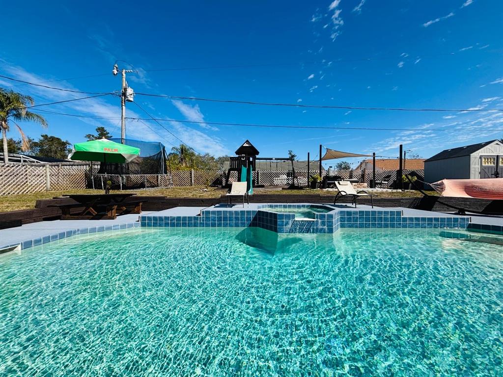 1464 Howland Boulevard Deltona, FL 32738 - Photo 39 of 55 a view of a yard and front view of a house