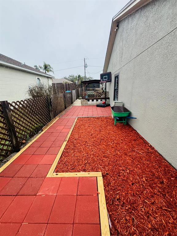 1464 Howland Boulevard Deltona, FL 32738 - Photo 40 of 55 a backyard of a house with lots of green space