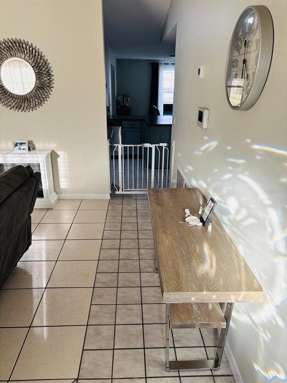 1464 Howland Boulevard Deltona, FL 32738 - Photo 4 of 55 a view of a livingroom with furniture and a floor to ceiling window