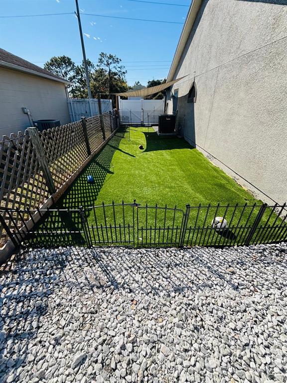 1464 Howland Boulevard Deltona, FL 32738 - Photo 45 of 55 a front view of a house having yard