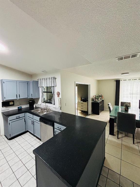 1464 Howland Boulevard Deltona, FL 32738 - Photo 48 of 55 a kitchen with stainless steel appliances kitchen island granite countertop a sink and cabinets