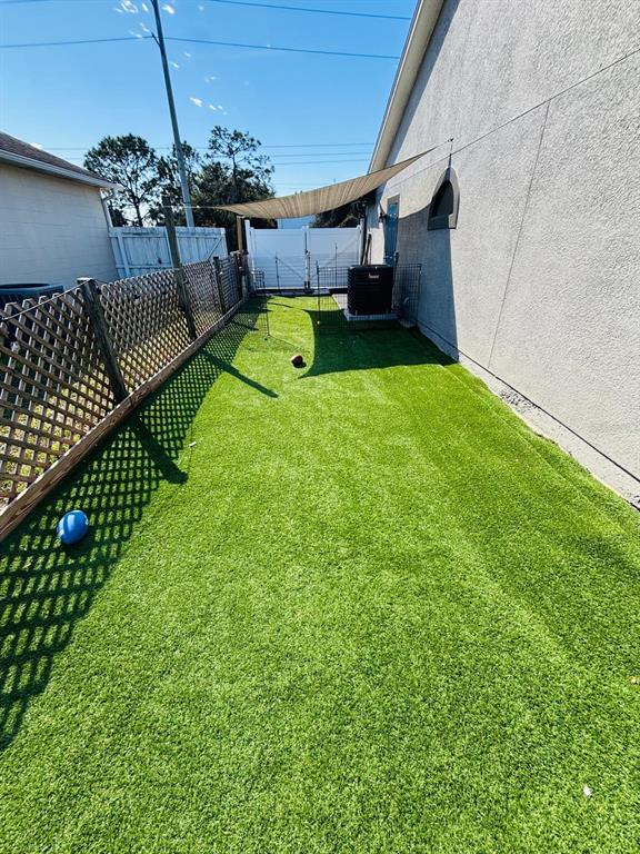 1464 Howland Boulevard Deltona, FL 32738 - Photo 50 of 55 a view of a backyard with a garden