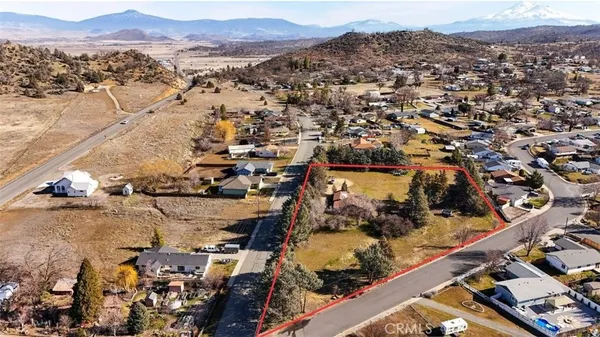 an aerial view of residential building and trees