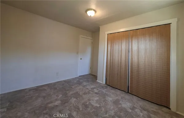 an empty room with a empty space and windows