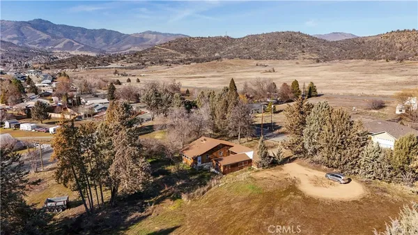 an aerial view of residential building and trees