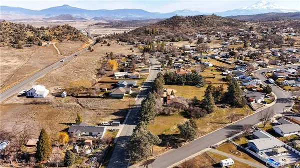 a view of a house with a yard and balcony