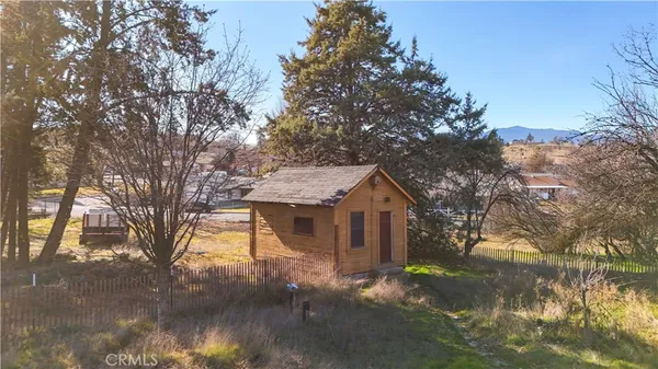 an aerial view of residential houses with city view