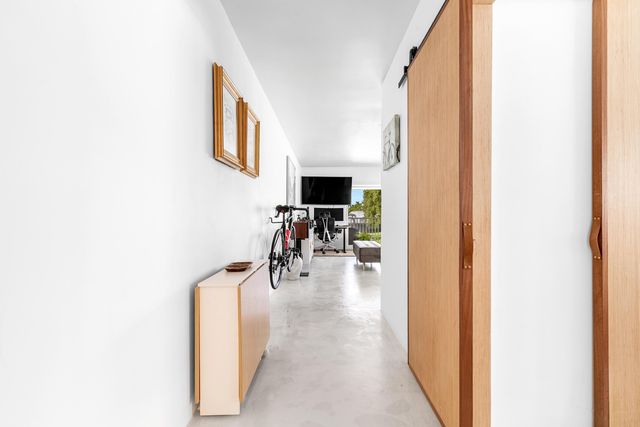 a lake view with boat and palm trees