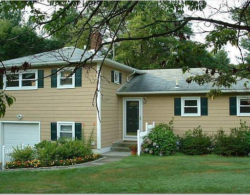 9 Algonquin Road Norwalk, CT 06851 - Photo 1 of 1 a front view of house with yard and green space