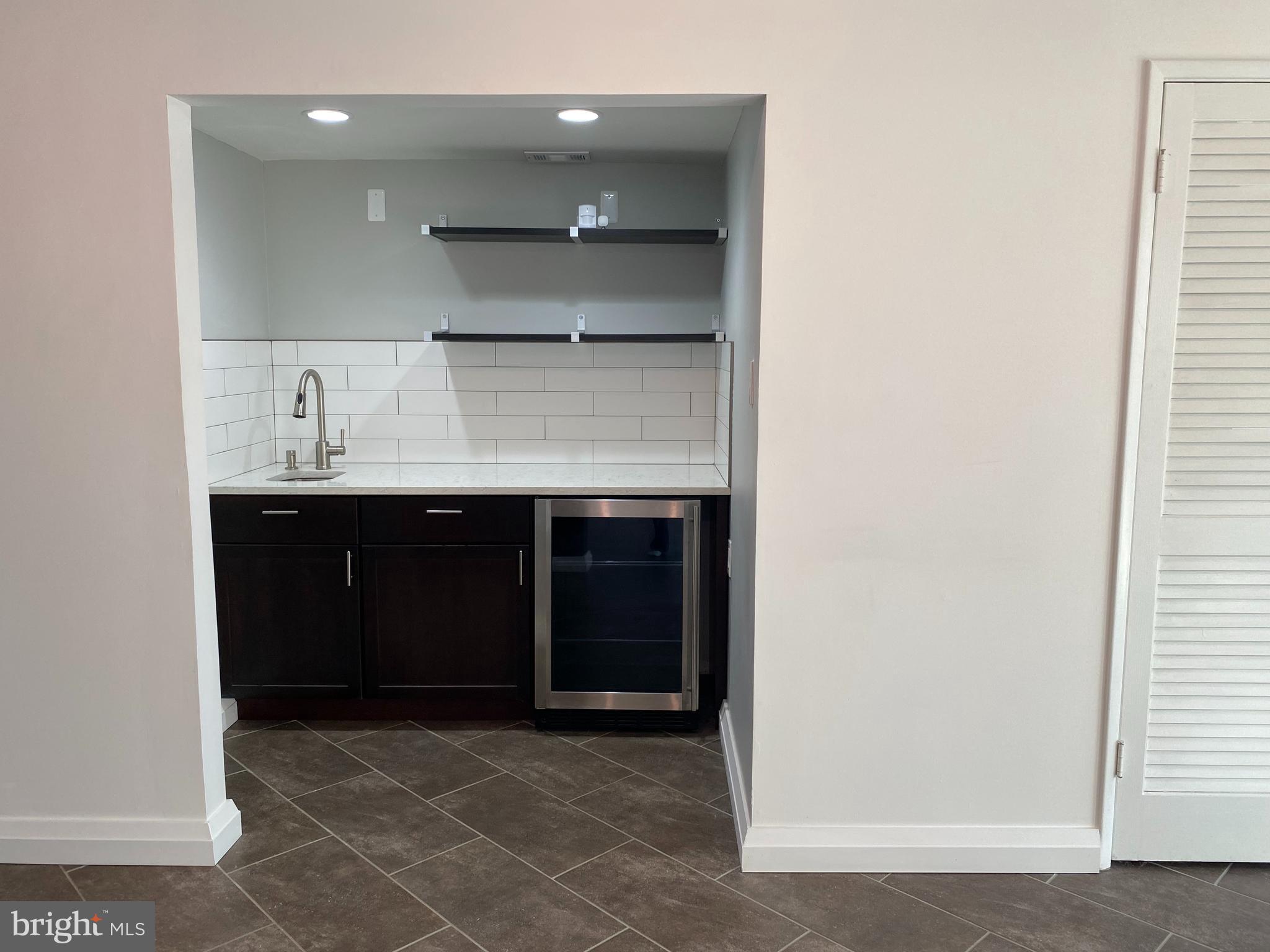 11142 Saffold Way Reston, VA 20190 - Photo 65 of 102 Recreation room kitchen bar area