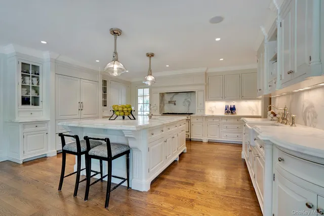 a utility room with cabinets washer and dryer