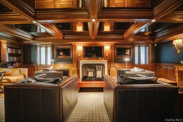 a view of a backyard with table and chairs under an umbrella