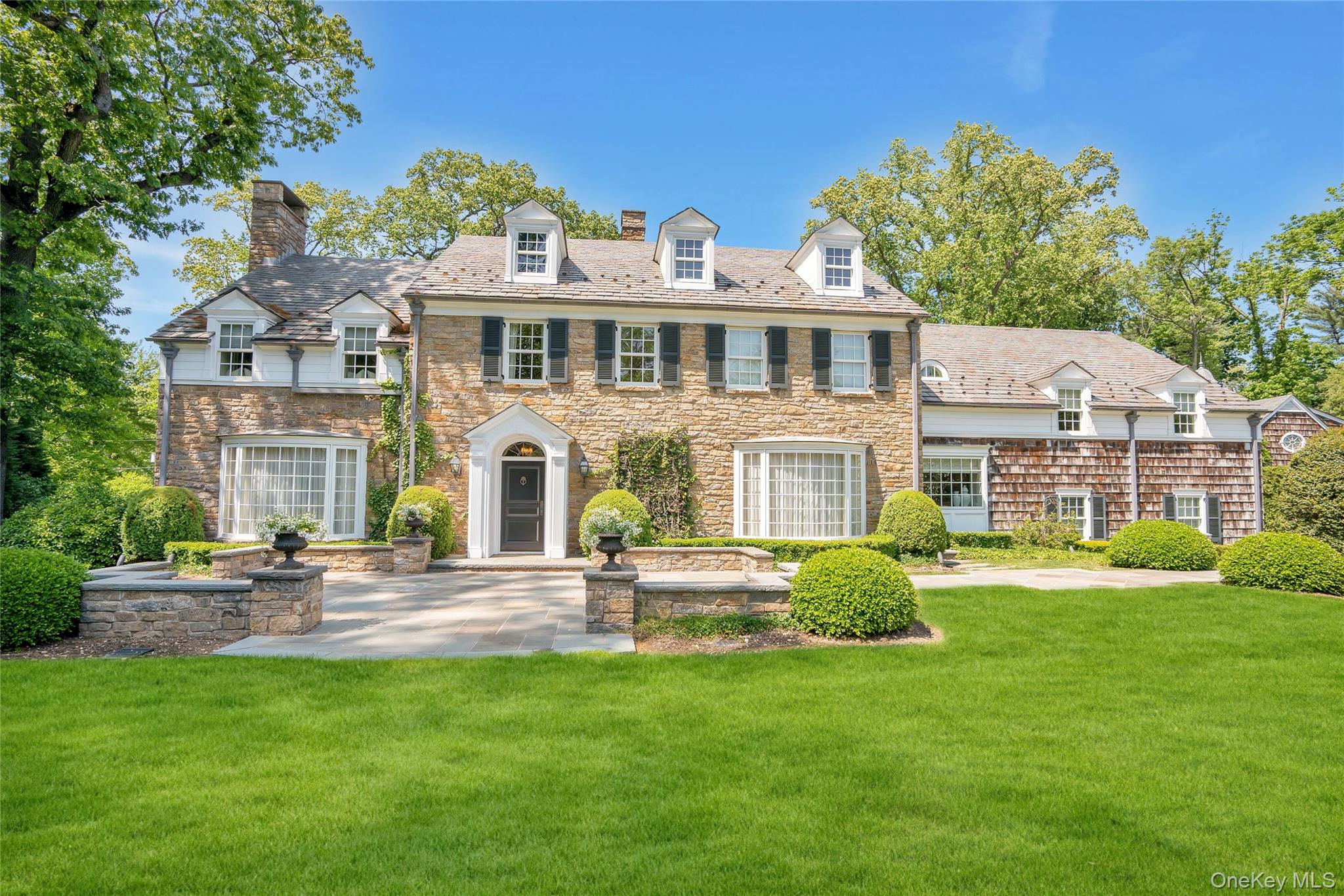 191 Elderfields Road Manhasset, NY 11030 - Photo 2 of 6 a front view of house with yard and green space