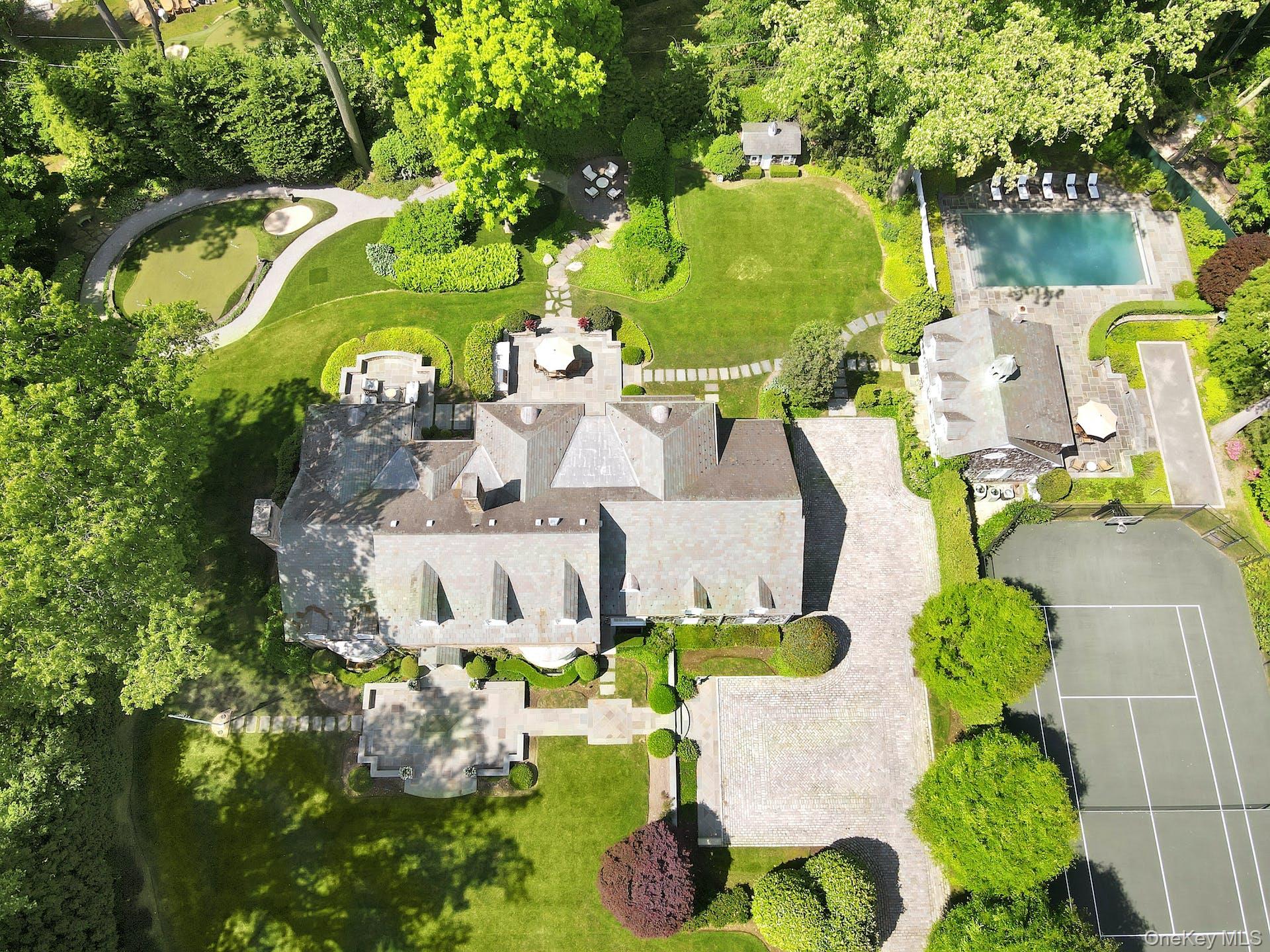 191 Elderfields Road Manhasset, NY 11030 - Photo 33 of 34 an aerial view of a house with swimming pool and outdoor seating