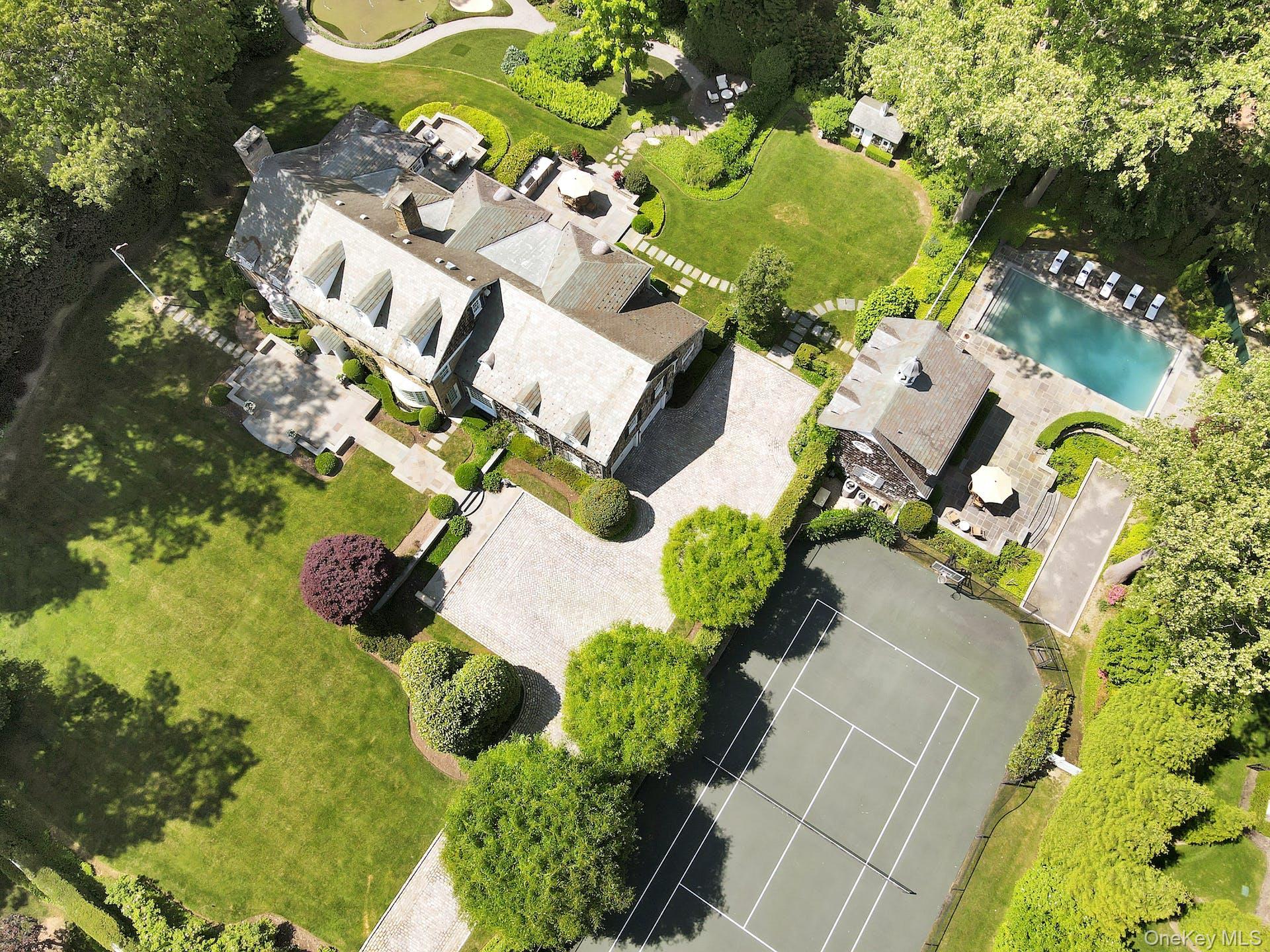 191 Elderfields Road Manhasset, NY 11030 - Photo 34 of 34 an aerial view of a house with a yard and outdoor seating