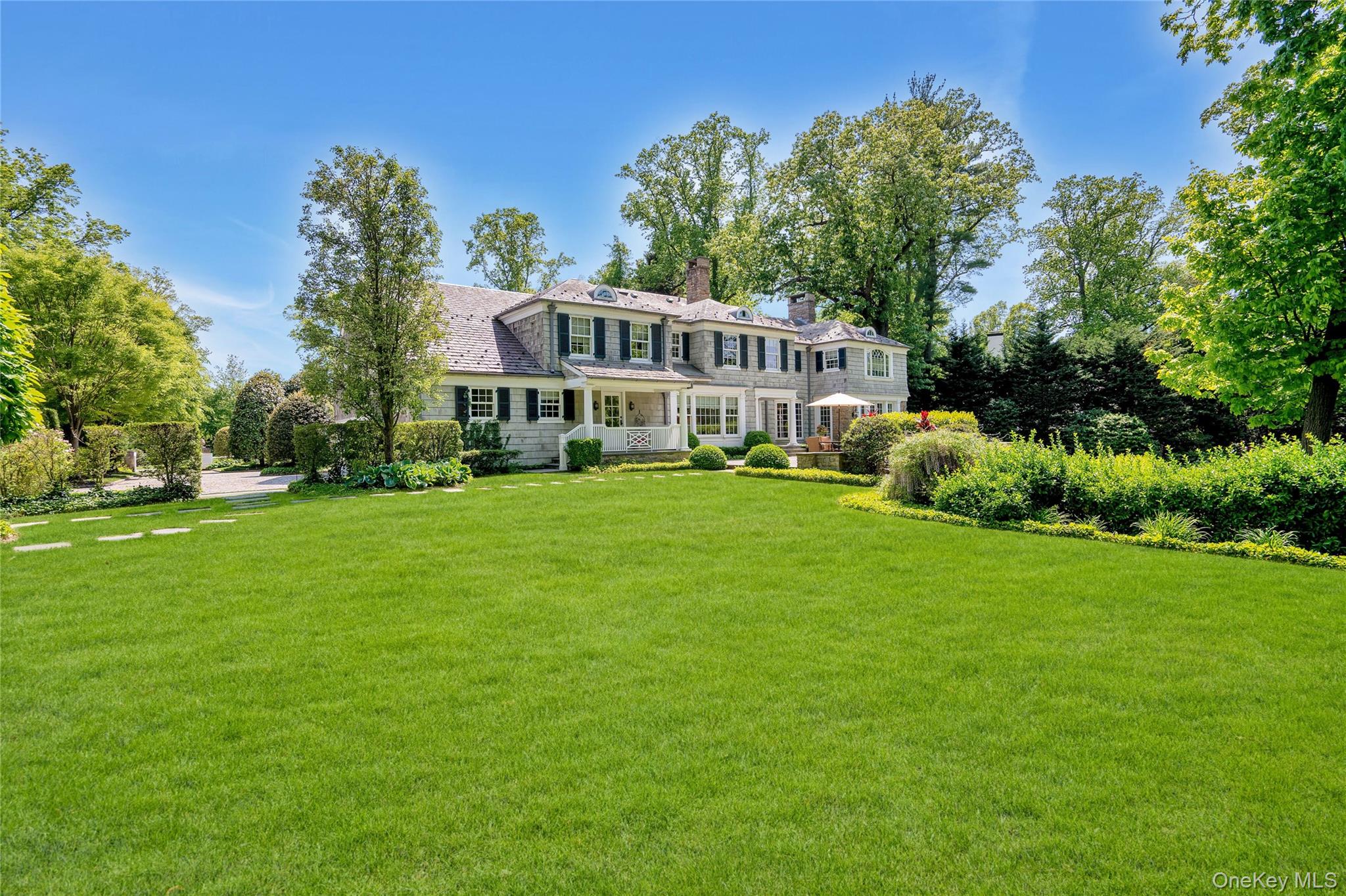 191 Elderfields Road Manhasset, NY 11030 - Photo 6 of 6 a view of a house with a big yard