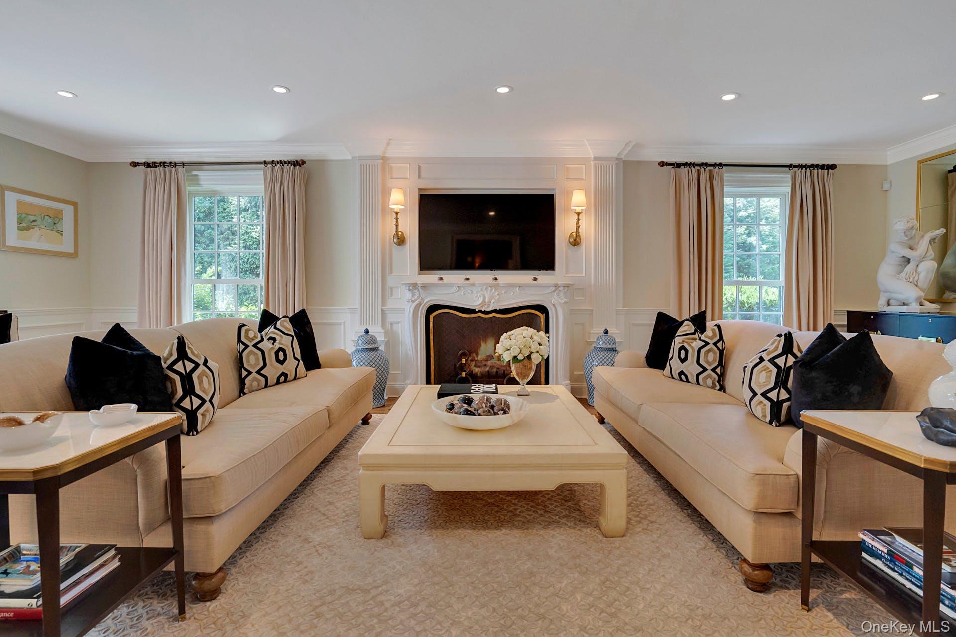 191 Elderfields Road Manhasset, NY 11030 - Photo 6 of 34 a living room with furniture fireplace and a window