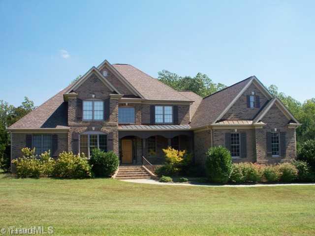 8404 Parkchester Place Oak Ridge, NC 27310 - Photo 1 of 16 Exterior Front.