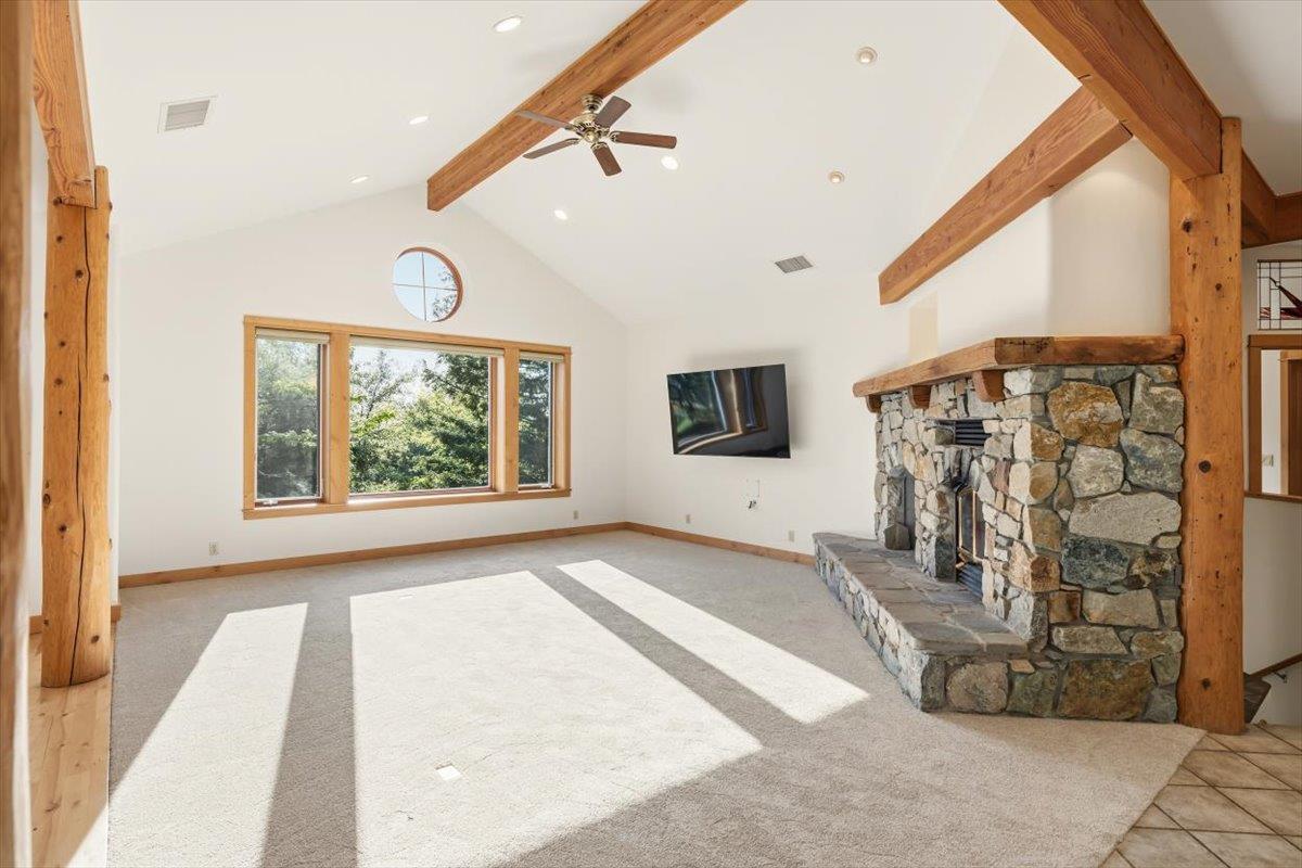 12531 Lowhills Road Nevada City, CA 95959 - Photo 10 of 92 a view of a livingroom with wooden floor and a ceiling fan