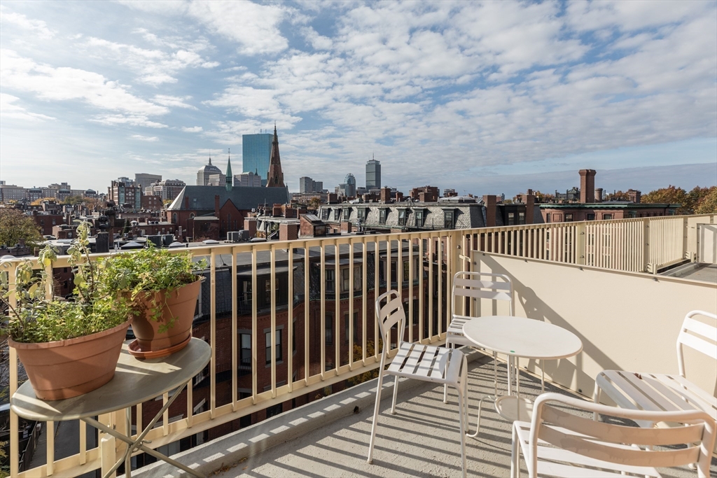 145 Pinckney Street, Unit 719 Boston, MA 02114 - Photo 5 of 11 a view of a balcony with city view