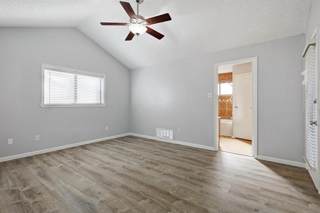 266 Pinyon Lane Coppell, TX 75019 - Photo 11 of 20 a view of empty room with wooden floor and fan