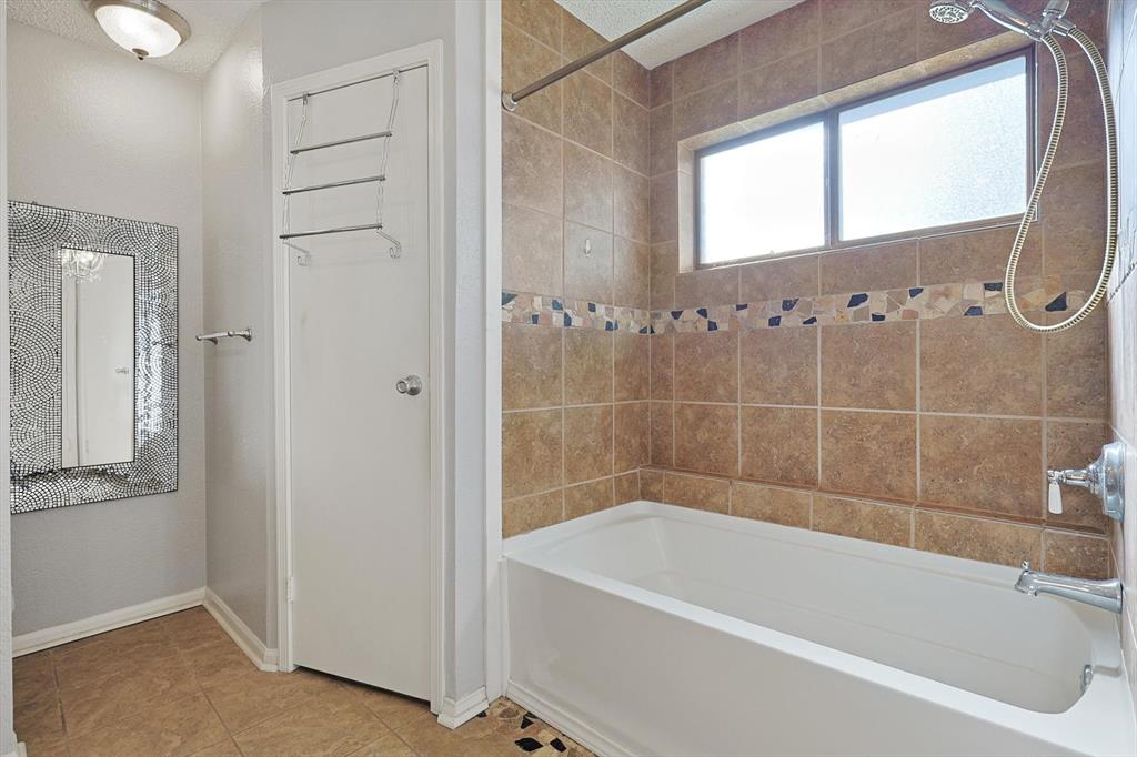266 Pinyon Lane Coppell, TX 75019 - Photo 13 of 20 a bath tub sitting next to a window