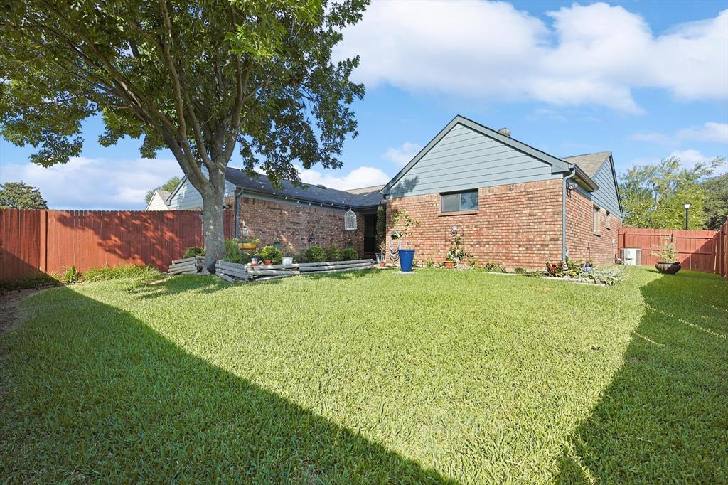 266 Pinyon Lane Coppell, TX 75019 - Photo 20 of 20 a view of a house with backyard and garden