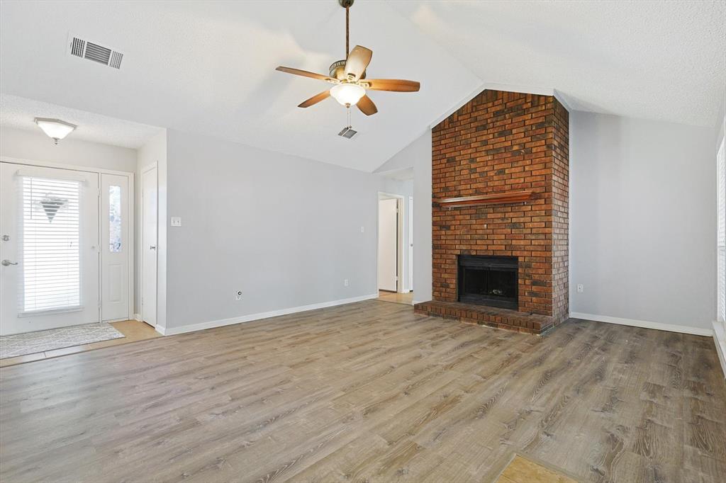 266 Pinyon Lane Coppell, TX 75019 - Photo 4 of 20 a view of an empty room with a fireplace