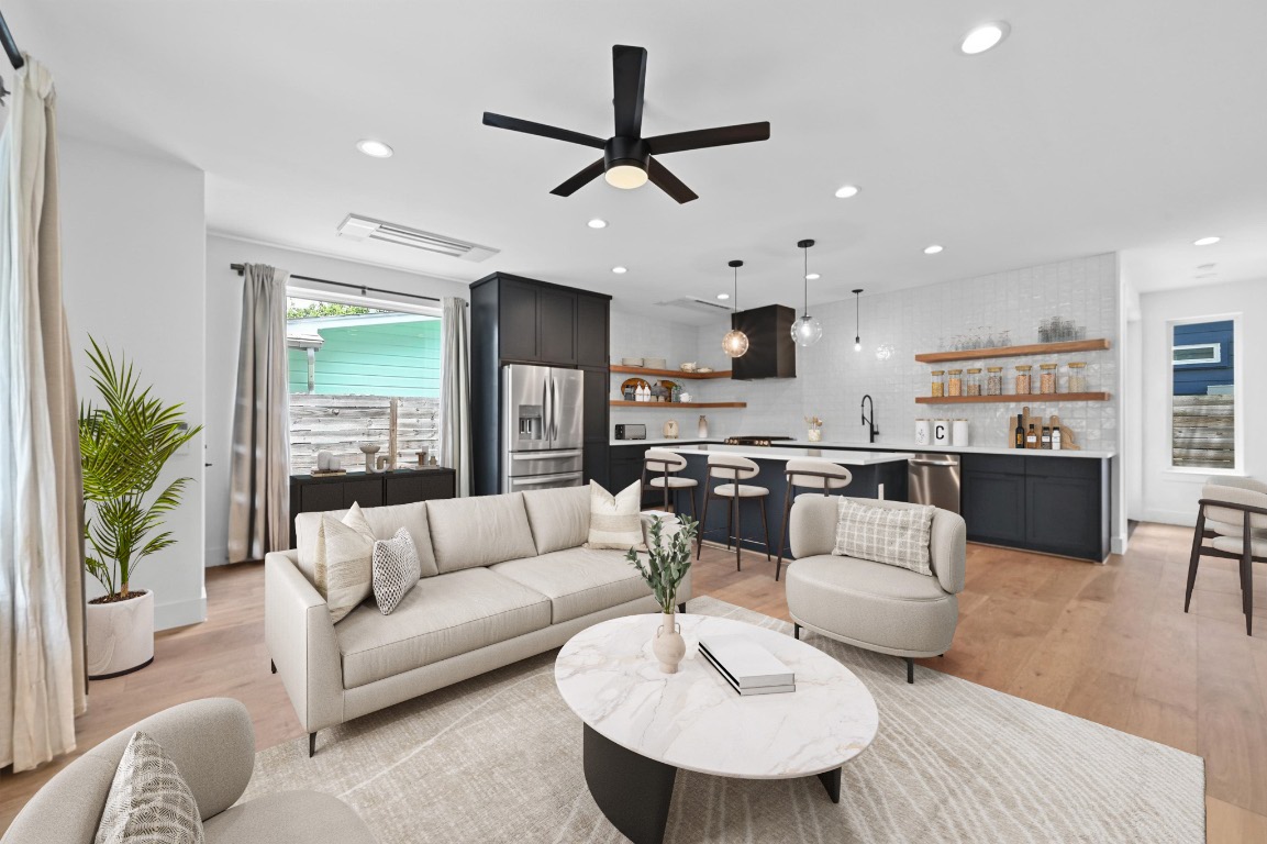 504 Normandy Street, Unit A Austin, TX 78745 - Photo 1 of 20 a living room with furniture kitchen view and a large window