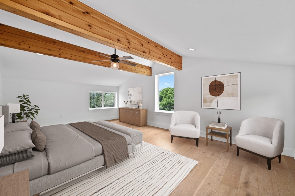 504 Normandy Street, Unit A Austin, TX 78745 - Photo 17 of 20 a bedroom with furniture and a large window