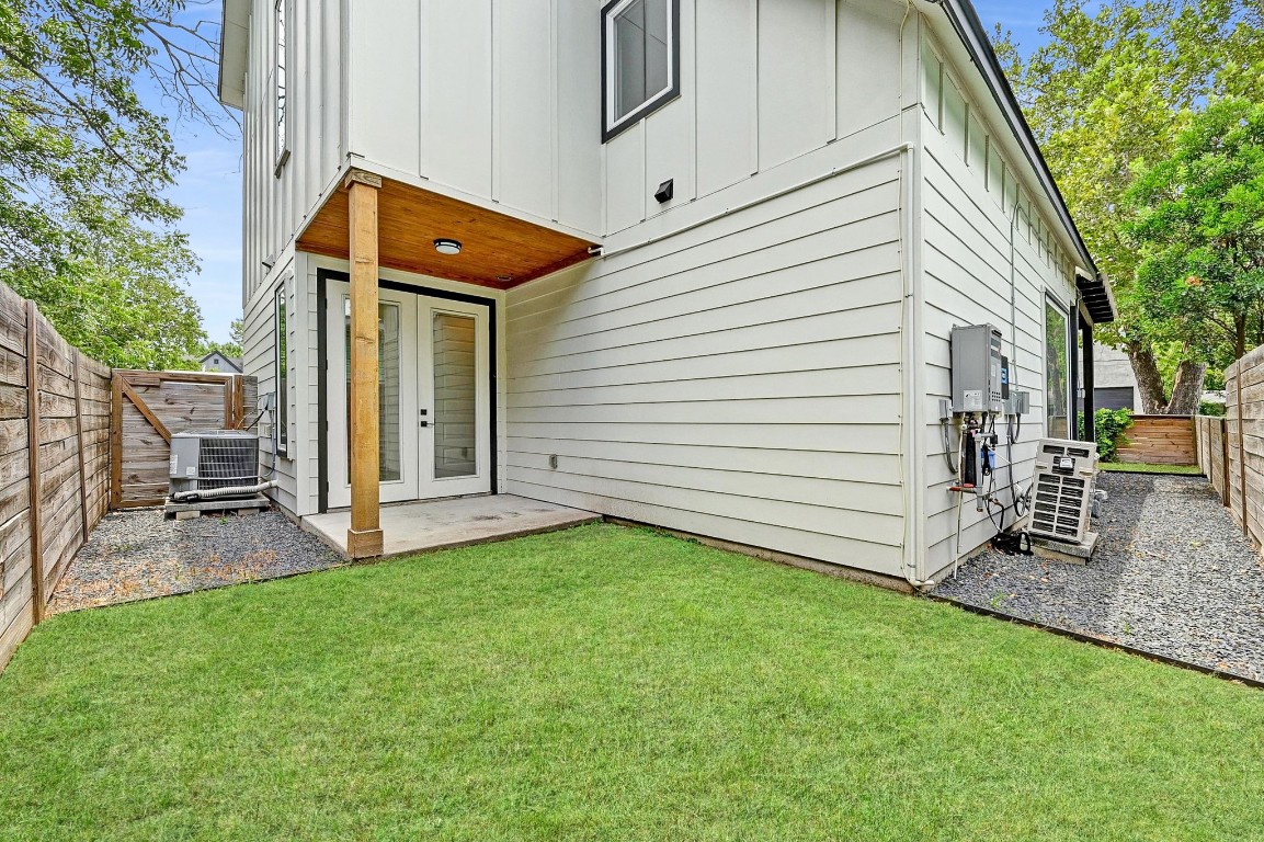 504 Normandy Street, Unit A Austin, TX 78745 - Photo 20 of 20 a view of a house with backyard
