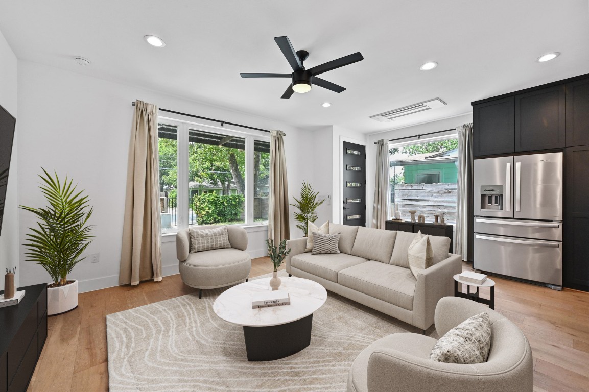 504 Normandy Street, Unit A Austin, TX 78745 - Photo 6 of 20 a living room with furniture and a large window