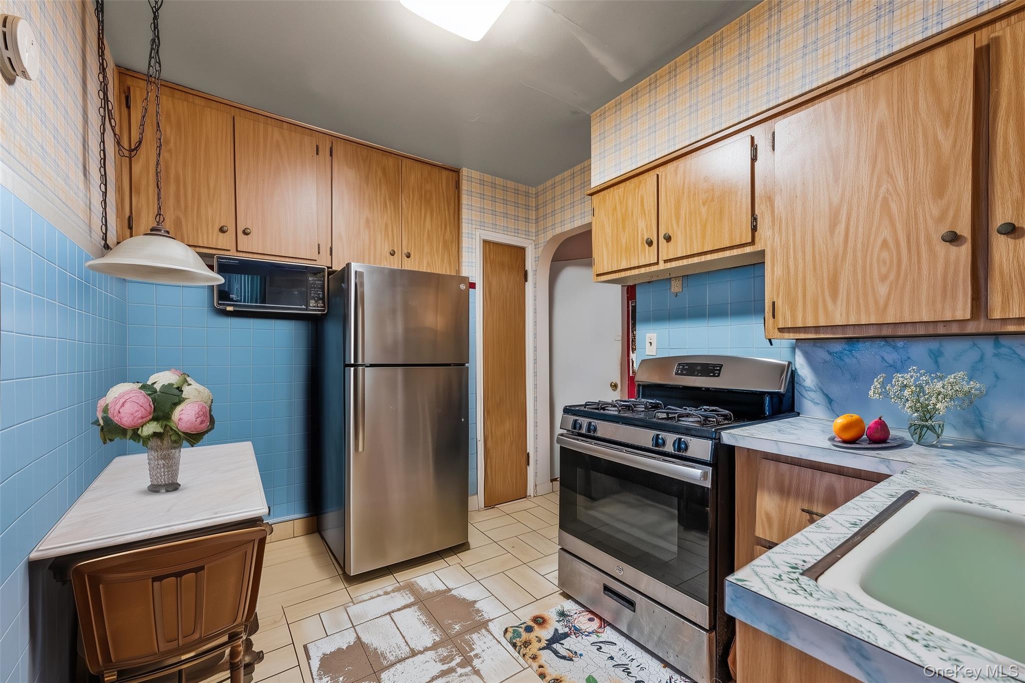 208 Dogwood Road Valley Stream, NY 11580 - Photo 11 of 38 a kitchen with stainless steel appliances granite countertop a refrigerator sink and stove