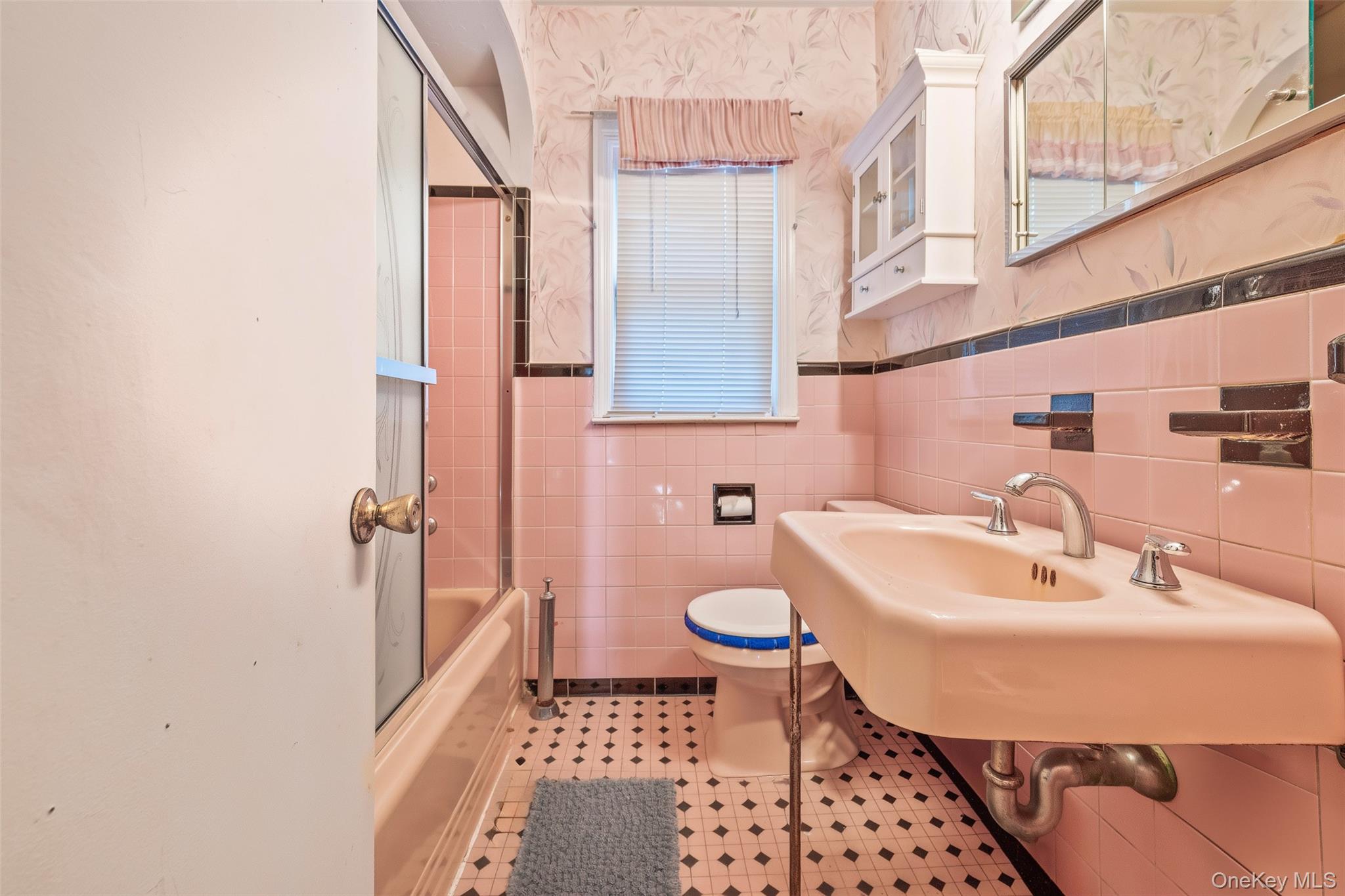 208 Dogwood Road Valley Stream, NY 11580 - Photo 12 of 38 a bathroom with a sink toilet and shower