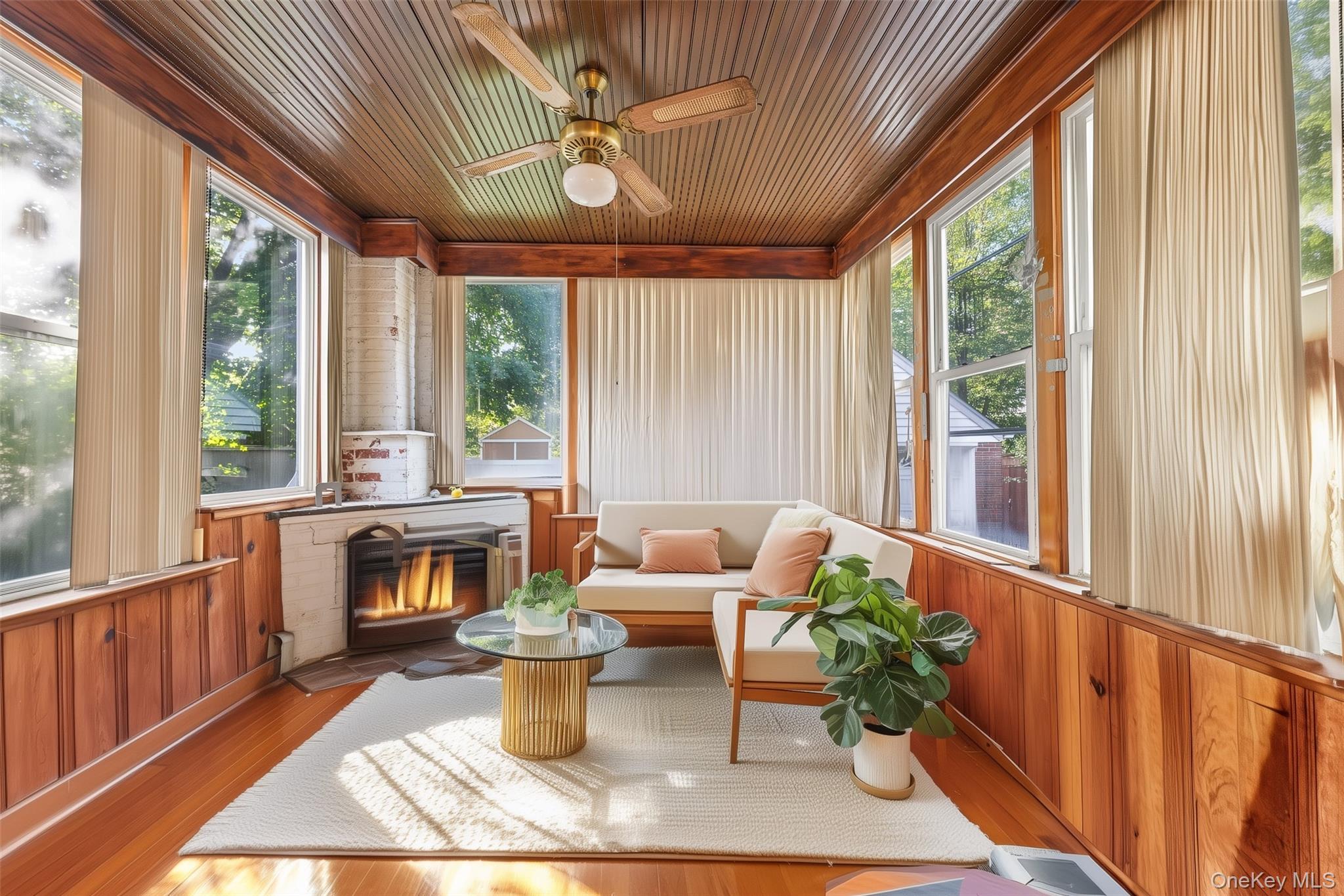 208 Dogwood Road Valley Stream, NY 11580 - Photo 18 of 38 a living room with furniture and a fireplace