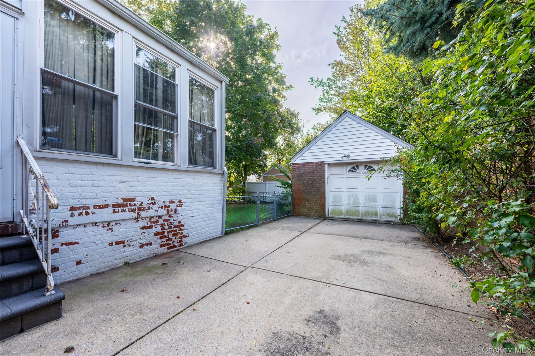 208 Dogwood Road Valley Stream, NY 11580 - Photo 30 of 38 a front view of a house with garage