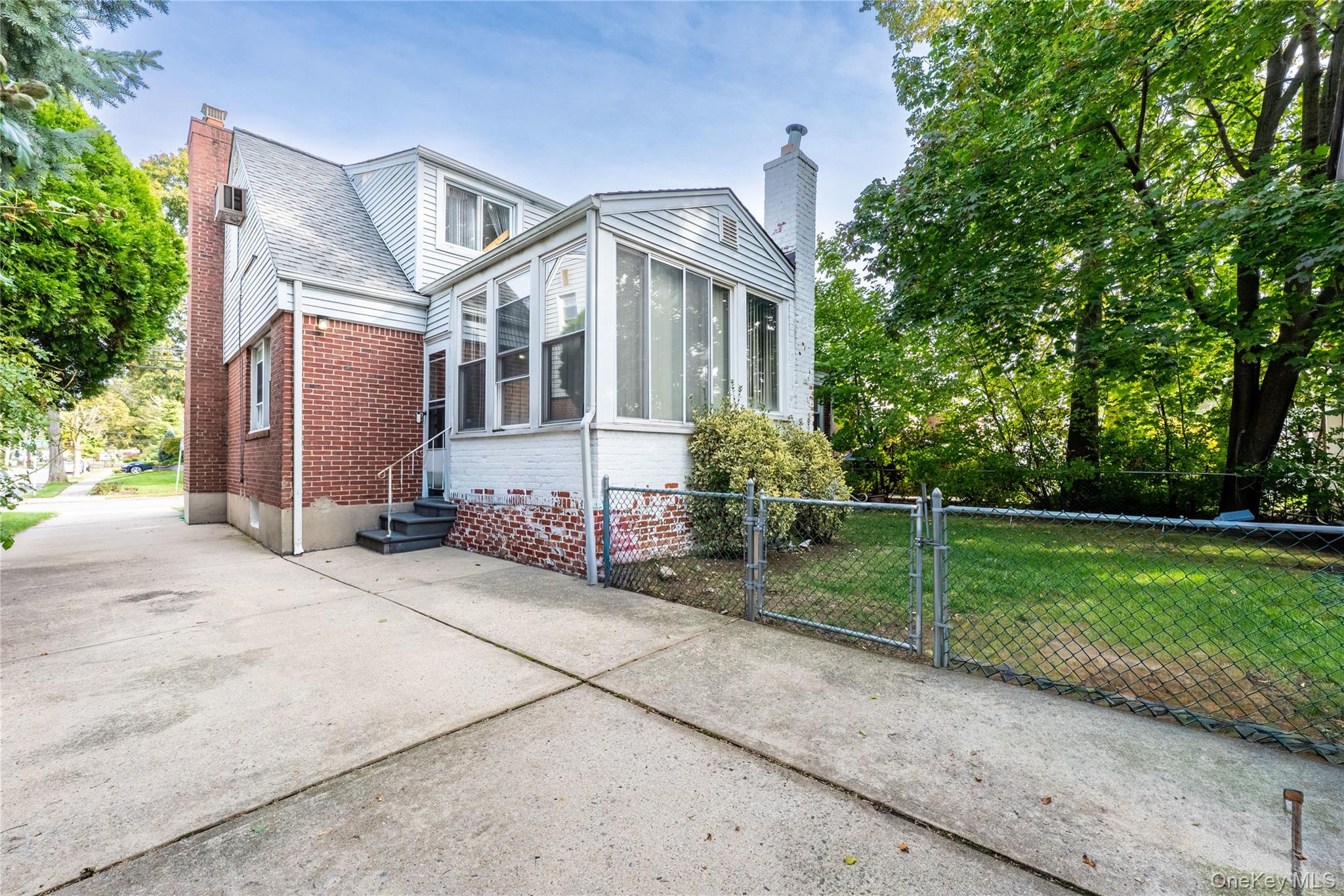 208 Dogwood Road Valley Stream, NY 11580 - Photo 31 of 38 a front view of a house with garden