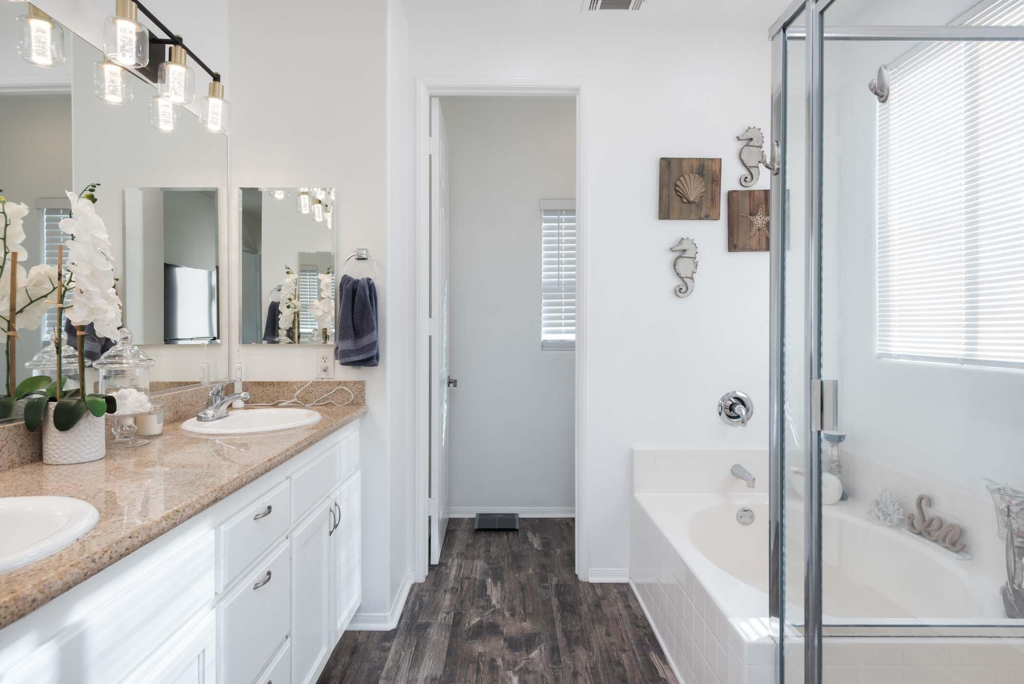 49534 Lewis Road Indio, CA 92201 - Photo 23 of 44 a bathroom with a granite countertop tub sink and mirror