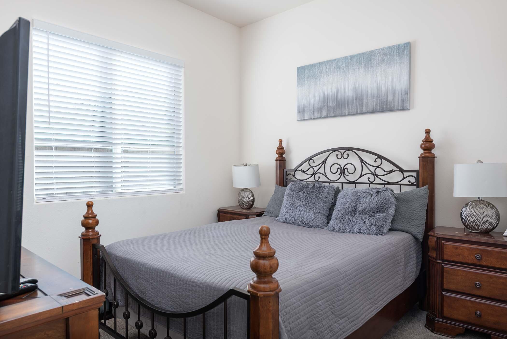 49534 Lewis Road Indio, CA 92201 - Photo 25 of 44 a bedroom with a bed a desk and chair