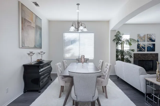 a bathroom with a granite countertop tub sink and mirror