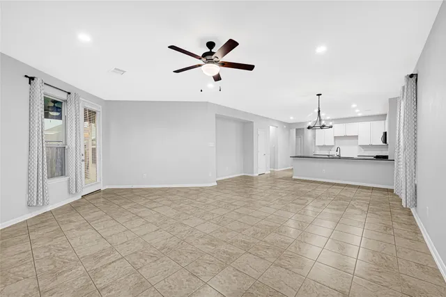 a view of a kitchen with a sink and a window