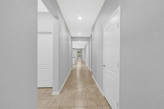 a view of a hallway with a white walls