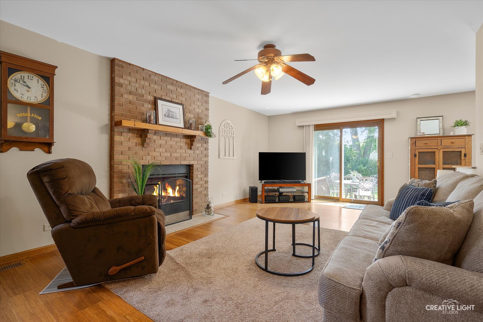 S085 Pleasant Hill Road Wheaton, IL 60187 - Photo 12 of 27 a living room with furniture and a flat screen tv