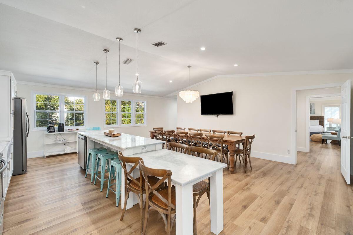 251 Dogwood Street Santa Rosa Beach, FL 32459 - Photo 15 of 51 a view of a dining room with furniture wooden floor and a rug