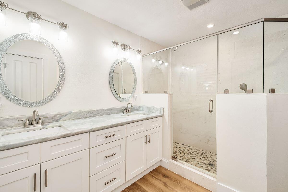 251 Dogwood Street Santa Rosa Beach, FL 32459 - Photo 20 of 51 a bathroom with a double vanity sink mirror and shower