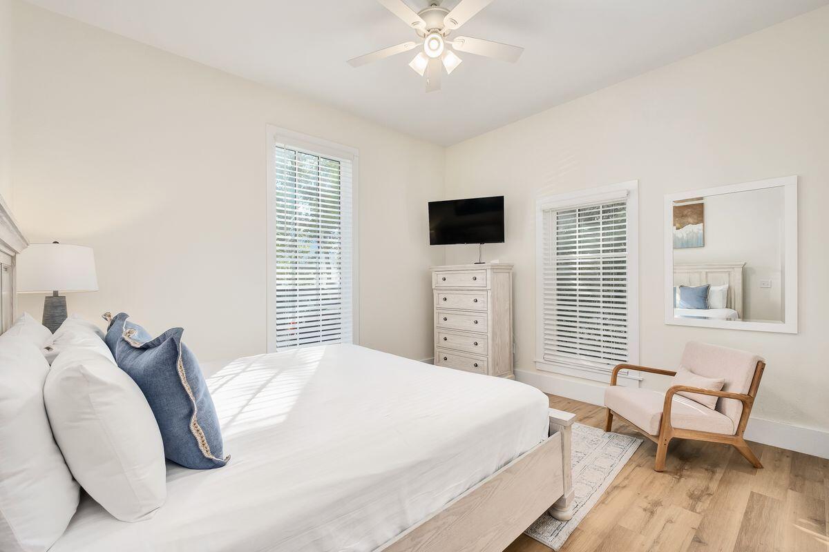 251 Dogwood Street Santa Rosa Beach, FL 32459 - Photo 24 of 51 a bedroom with a bed and a chair