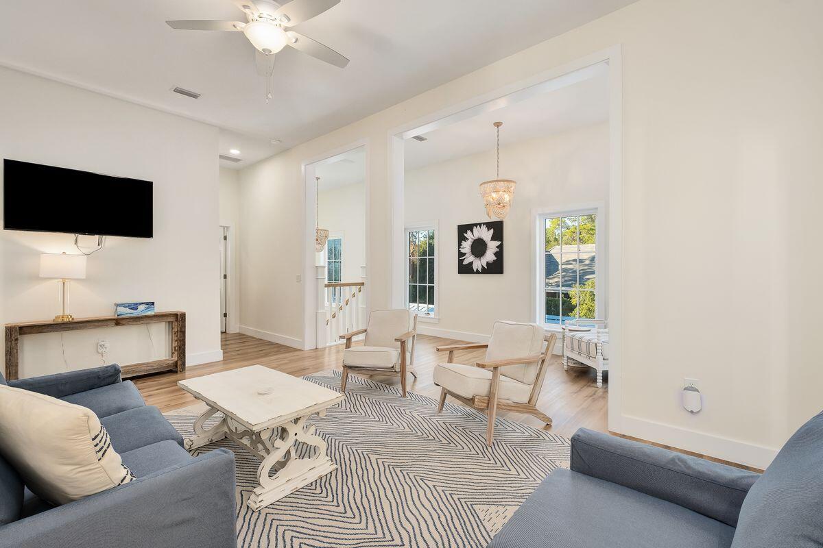 251 Dogwood Street Santa Rosa Beach, FL 32459 - Photo 25 of 51 a living room with furniture and a flat screen tv